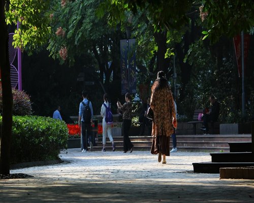 Indian family walking together in a park morning scene